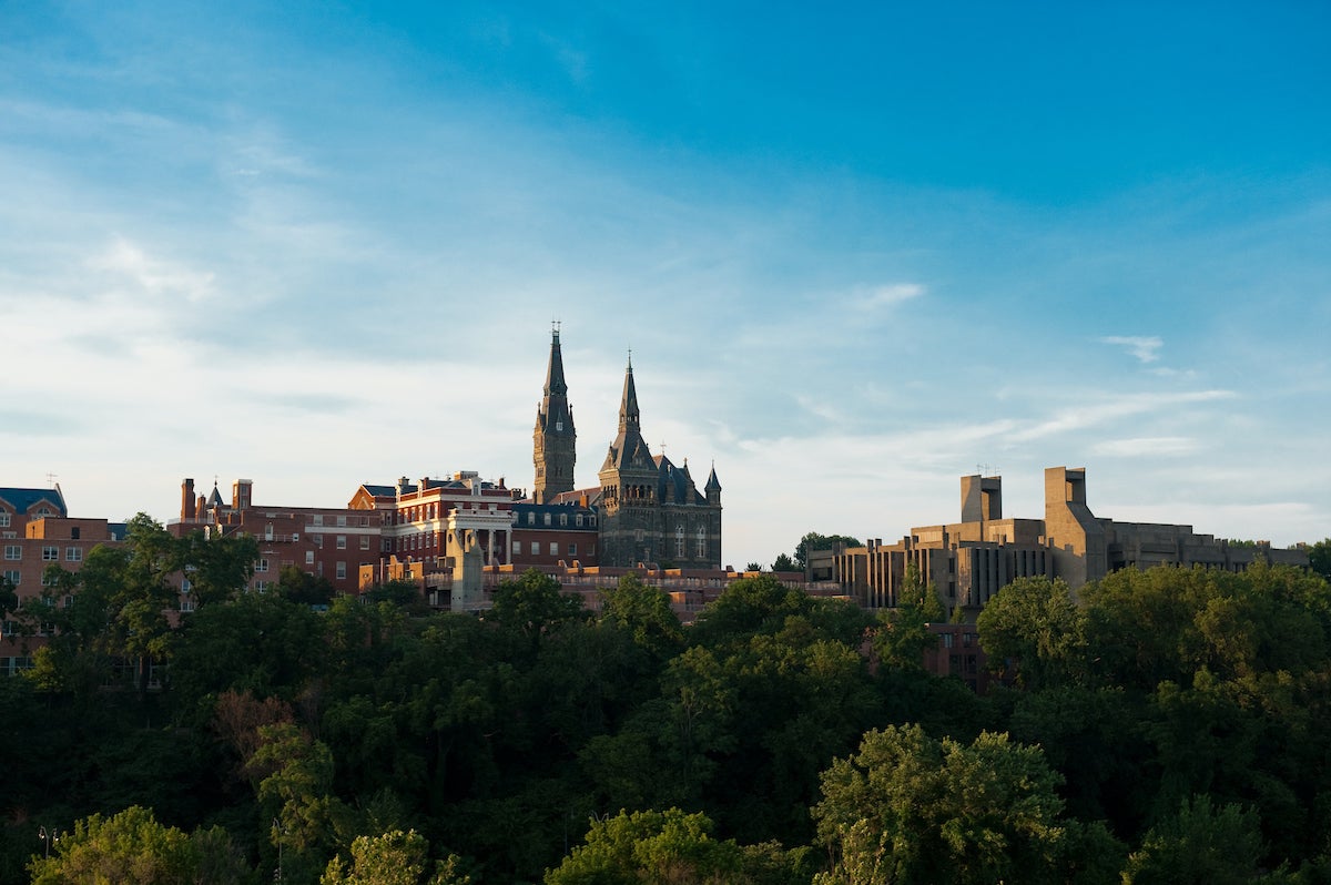 A far away image of Healy Hall among trees