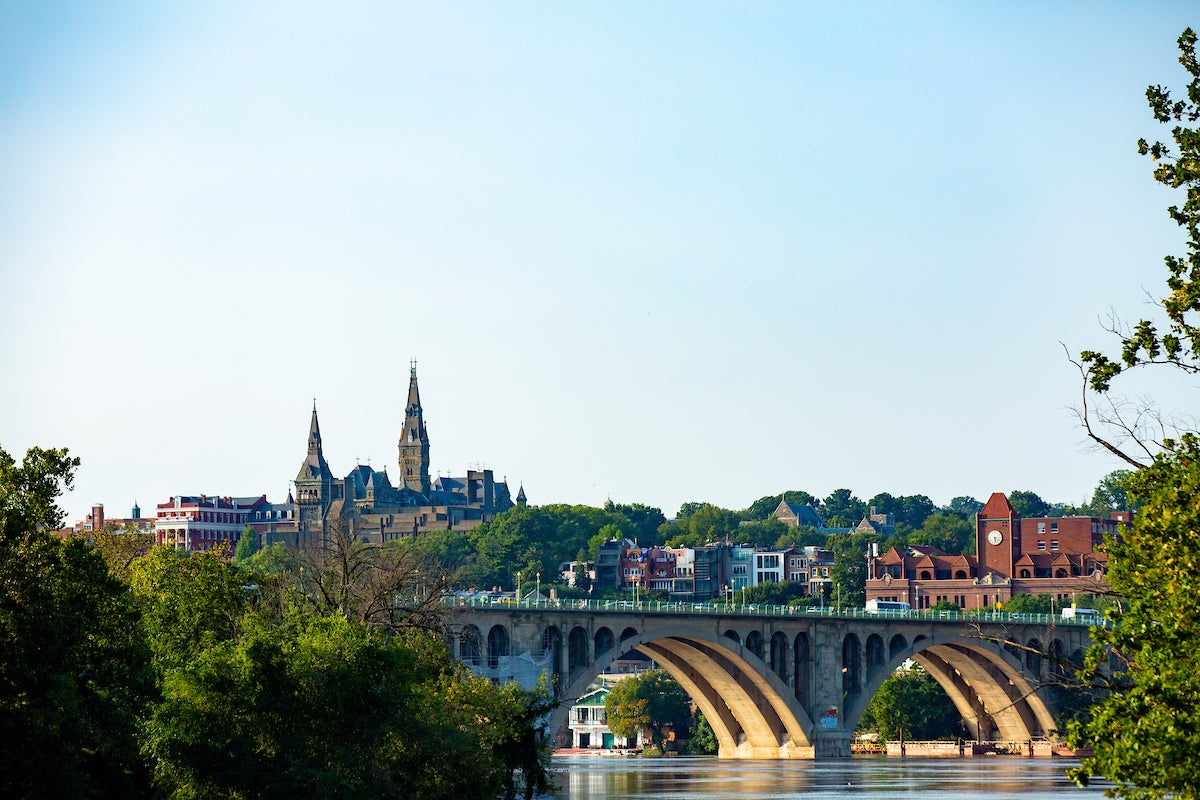 An image of the Key Bridge with Healy Hall and the Car Barn in the background