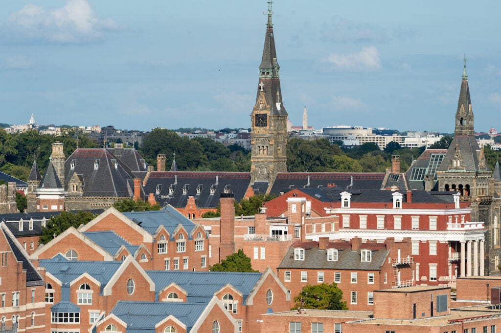 View of Healy Hall clocktower and surrounding buildings - from a drone